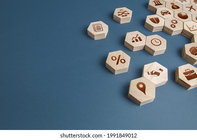 Wooden figurines with business attributes. Components for building a successful company and career growth. Management. Improving the investment climate, attracting investors. Business education. - Shutterstock ID 1991849012