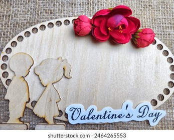 Wooden figurines of couple, inscription Valentine's Day, red flowers. Concept of holiday of love. Background, texture, frame, place for text, copy space - Powered by Shutterstock