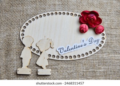 Wooden figurines of couple, inscription Valentine's Day, red flowers. Concept of holiday of love. Background, texture, frame, place for text, copy space - Powered by Shutterstock