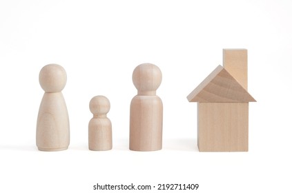 Wooden figurines of family father, mother, children. Wooden figurines concept. model house on a white background. Real estate purchase, rental concept. warm family concept. - Shutterstock ID 2192711409