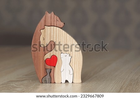 Wooden figurines of a family of father, mother, children. The concept of wooden figurines. warm family concept in the form of bears