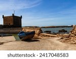 Wooden fishing boat on the waterfront of the old port. Fort Essaouira, Morocco, Africa