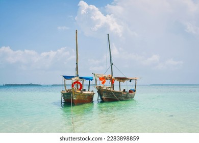 A wooden fishing boat with a traditional design, commonly found in Tanzania and located in the Indian Ocean near Zanzibar.