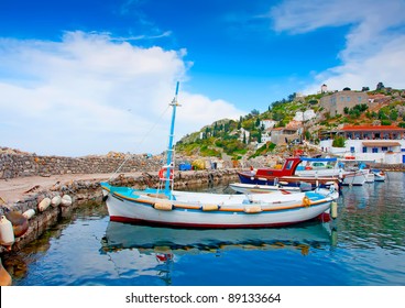 Wooden fishing boats in the beautiful small harbour Kamini of Hydra island in Saronikos gulf in Greece