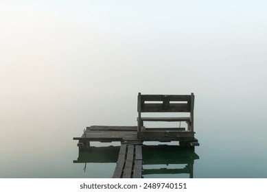 Wooden fishing bridge on a foggy lake at dawn. - Powered by Shutterstock