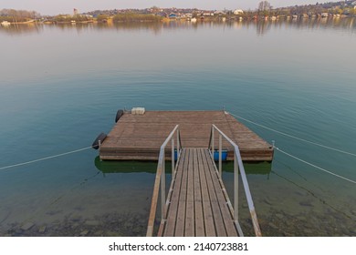 Wooden Floating Pontoon Dock At Calm River Water