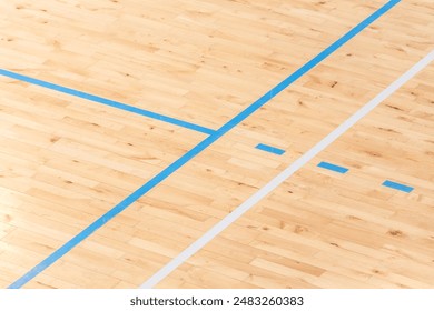 Wooden floor basketball, badminton, futsal, handball, volleyball, football, soccer court. Wooden floor of sports hall with marking lines on wooden floor indoor, gym court - Powered by Shutterstock