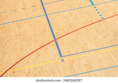 Wooden floor basketball, badminton, futsal, handball, volleyball, football, soccer court. Wooden floor of sports hall with marking lines on wooden floor indoor, gym court - Powered by Shutterstock