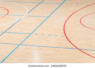 Wooden floor basketball, badminton, futsal, handball, volleyball, football, soccer court. Wooden floor of sports hall with marking lines on wooden floor indoor, gym court - Powered by Shutterstock