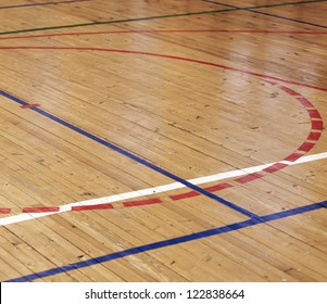 Wooden floor of sports hall with colorful marking lines - Powered by Shutterstock