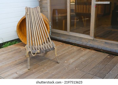 Wooden Folding Chair Near The Glass Doors In The Country House.