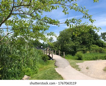 A Wooden Footbridge Over A Stream In Babylon Village, Long Island, New York.