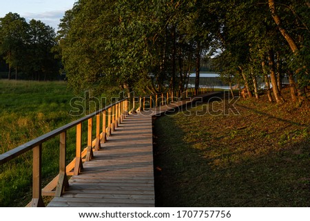 Similar – Image, Stock Photo Lake with wooden footbridges