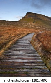Wooden footpath over bog land leading ot Pen-y-Ghent in Yorkshire Dales National Park
