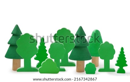 Wooden forest toy isolated on white. Children's wooden toys for creativity and skills development. Environmental protection concept. Montessori education.