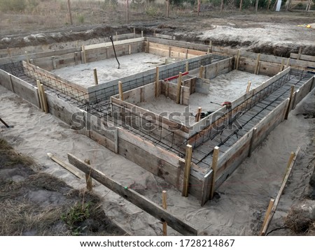 Wooden formwork concrete strip foundation for a cottage.