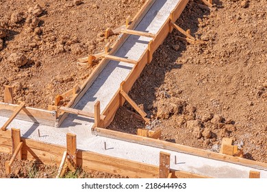 Wooden Formwork For Pouring Concrete Foundation Of The House. Foundation Construction.