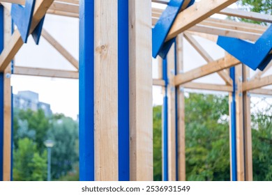 wooden frame beams commercial building in progress, construction elements, skeletal frame, building progress, raw materials, development project - Powered by Shutterstock