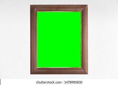 Wooden Frame With Green Screen And White Wall