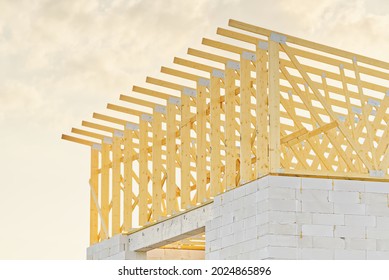 Wooden Frame Roof Construction For A New Domestic House. Residential House Construction Site. Development Of Small Construction