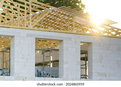 Wooden Frame Roof Construction For A New Domestic House. Residential House Construction Site. Development Of Small Construction