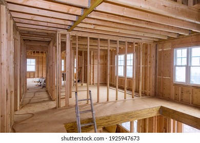 Wooden frame structure house building on a new development framing of under construction