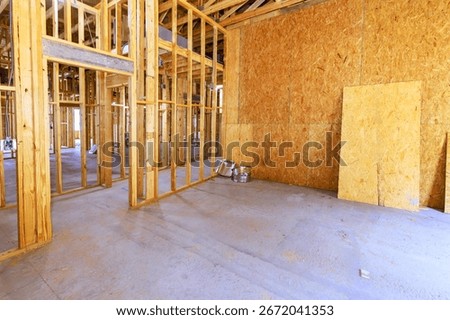 Wooden frames are outlined within spacious construction site, beams frame of upcoming development.