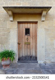 Wooden Front Door Of A Beautiful Old Cottage House On A Street In An English Town