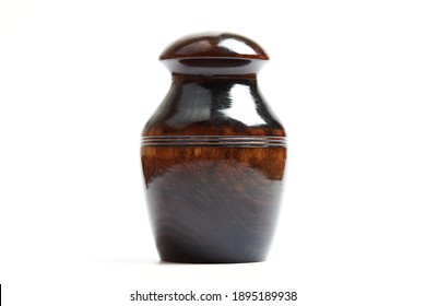 Wooden Funeral Urn Of Pet, Isolated White Background. Burial Cinerary Urn Close Up.