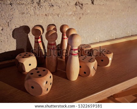 Wooden game pieces with dices as decor element.