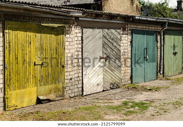Wooden garage doors of different colors,\
Ventspils, Latvia.