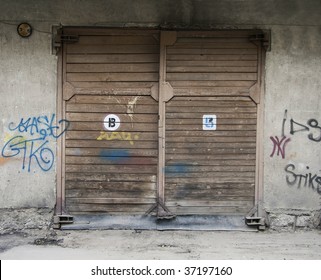 wooden Garage Doors and wall with graffiti - Shutterstock ID 37197160