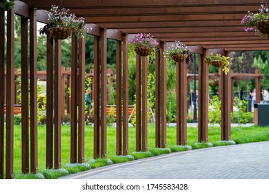 Wooden Garden Arch With Landscaping And Garden Street Flowers And Plants