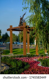 Wooden Garden Arch With Landscaping And Garden Street Flowers And Plants