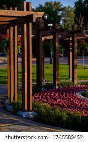 Wooden Garden Arch With Landscaping And Garden Street Flowers And Plants