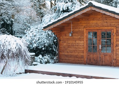 Wooden Garden Shed Covered With Snow. First Snow. Winter In The Garden