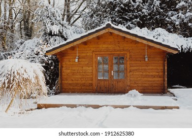 Wooden Garden Shed Covered With Snow. First Snow. Winter In The Garden