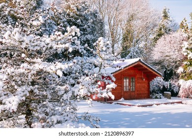 Wooden Garden Shed Covered With Snow. First Snow. Winter In The Garden