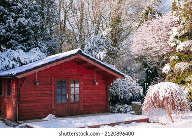 Wooden Garden Shed Covered With Snow. First Snow. Winter In The Garden