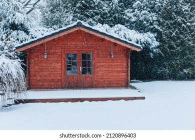 Wooden Garden Shed Covered With Snow. First Snow. Winter In The Garden