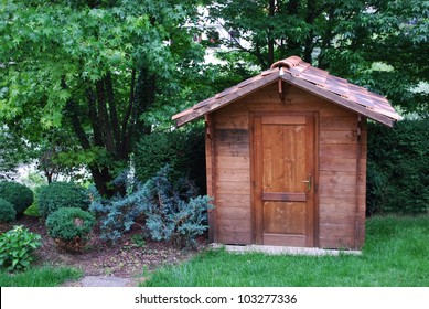 Wooden Garden Tool Shed In A Beautiful Park
