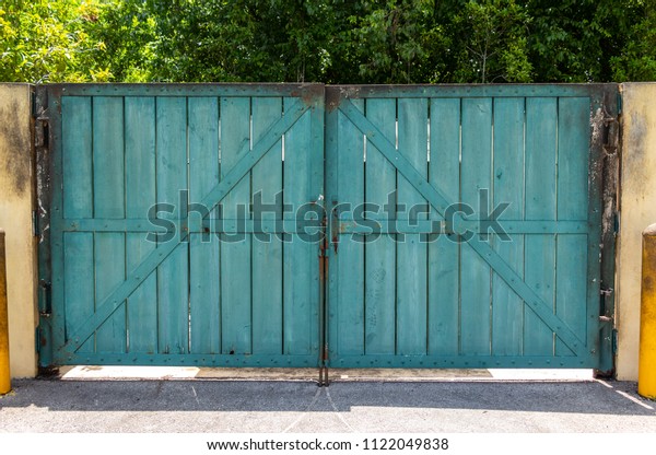Wooden Gate Doors Rusted Metal Frame Stock Photo Edit Now 1122049838