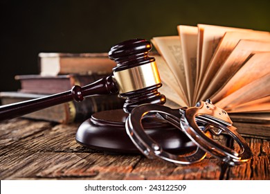 Wooden gavel and books on wooden table, law concept - Shutterstock ID 243122509