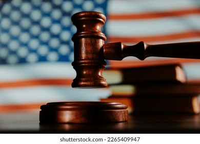 Wooden gavel and flag of United States of America. Law of USA concept. - Shutterstock ID 2265409947