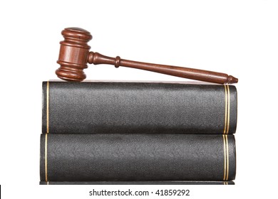 Wooden Gavel And Law Books Isolated On White Background. Shallow Depth Of Field