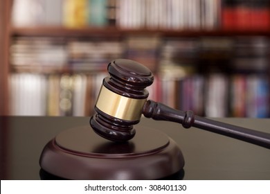 Wooden gavel on library background - Shutterstock ID 308401130