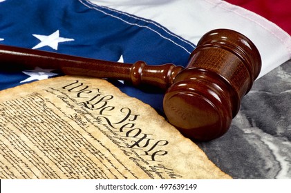 Wooden Gavel On Top Of American Flag And Bill Of Rights Document