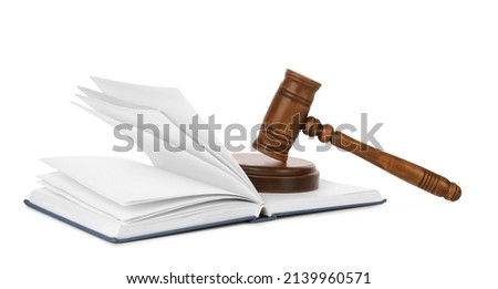 Wooden gavel and open book on white background