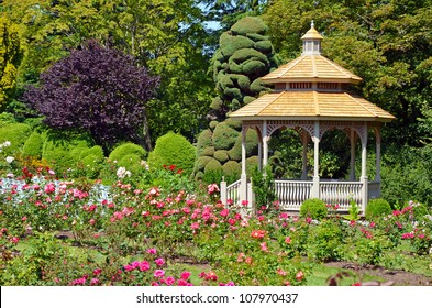 Wooden Gazebo In Colorful Spring Garden