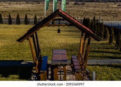 A Wooden Gazebo In The Park